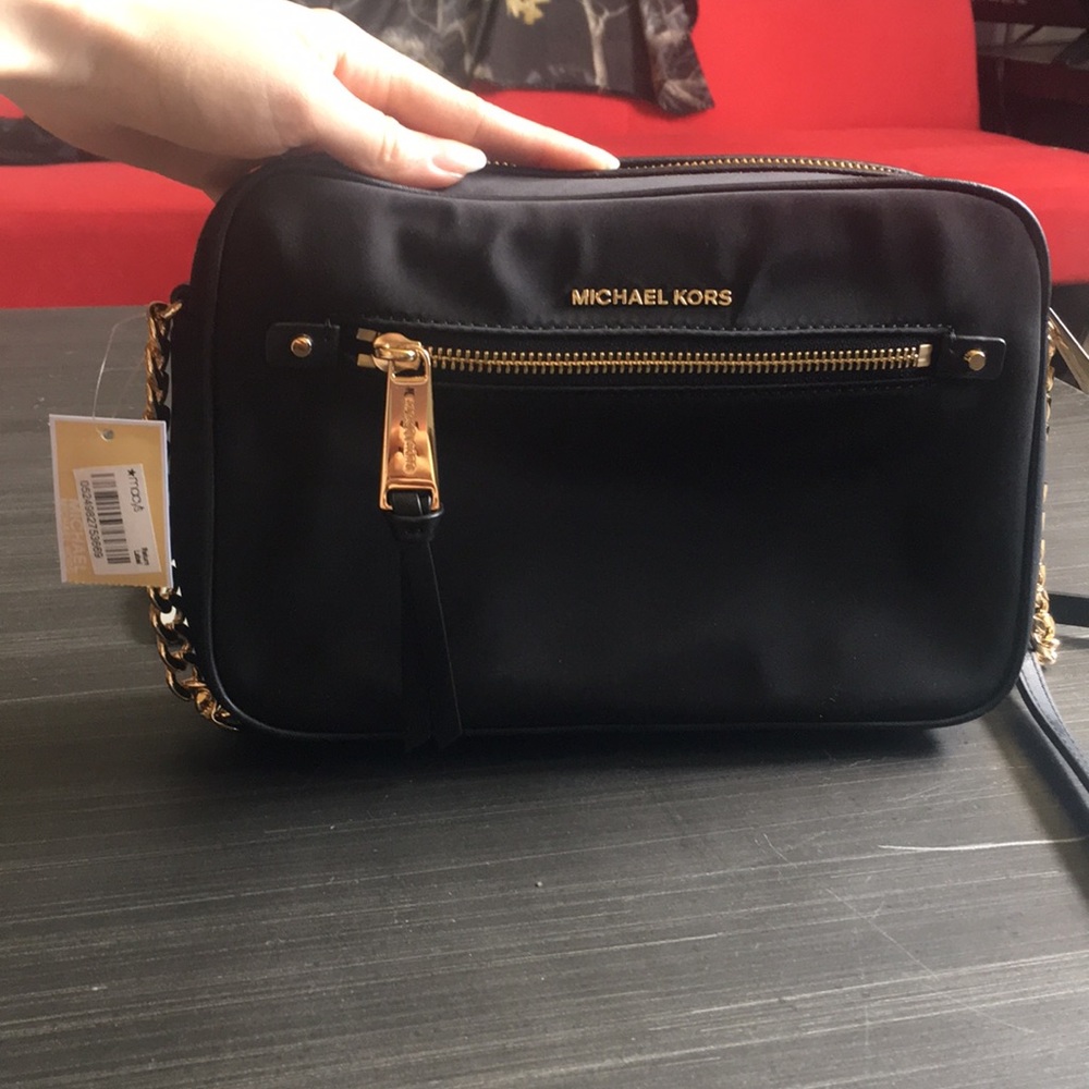 Micheal Kors Black gold cross body Polly